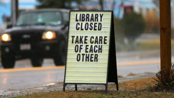 A sign displayed on the lawn of West Dennis Library, Massachusetts on March 18. The library is still “closed until further notice”