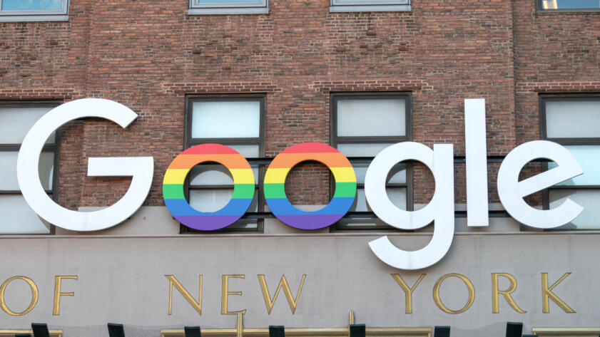 A photo of the Google logo on their New York building with some letters in the pride flag colors