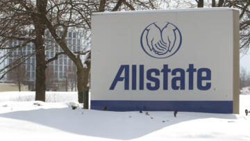 A sign showing the Allstate logo in front of their headquarters, with a winter backdrop.