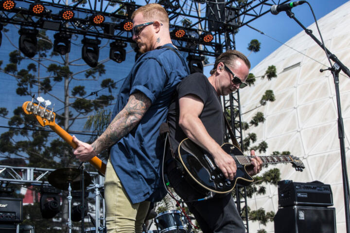 Photograph of Max Collins and Jon Siebels performing back-to-back on stage.