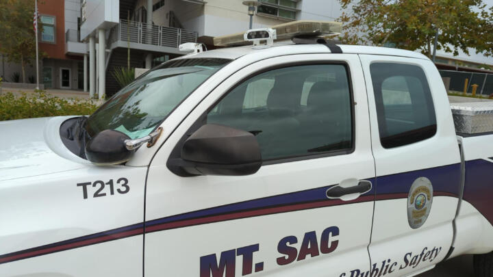 Photo of a white car with fixed cameras installed on its roof, with a decal on the door that reads “Mt. Sac Department of Public Safety.”