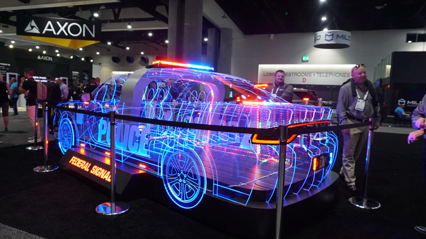 Photograph of an LED display of a cop car, with a sign that reads “Federal Signal” underneath it