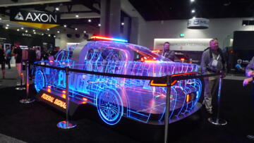 Photograph of an LED display of a cop car, with a sign that reads “Federal Signal” underneath it