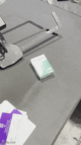 Animated GIF of a video panning through tracking devices disguised as a box of cigarettes and bottles of medication.