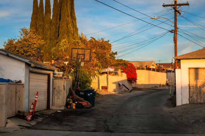 Photograph of the alleyway at the edge of Dana’s neighborhood during sunset