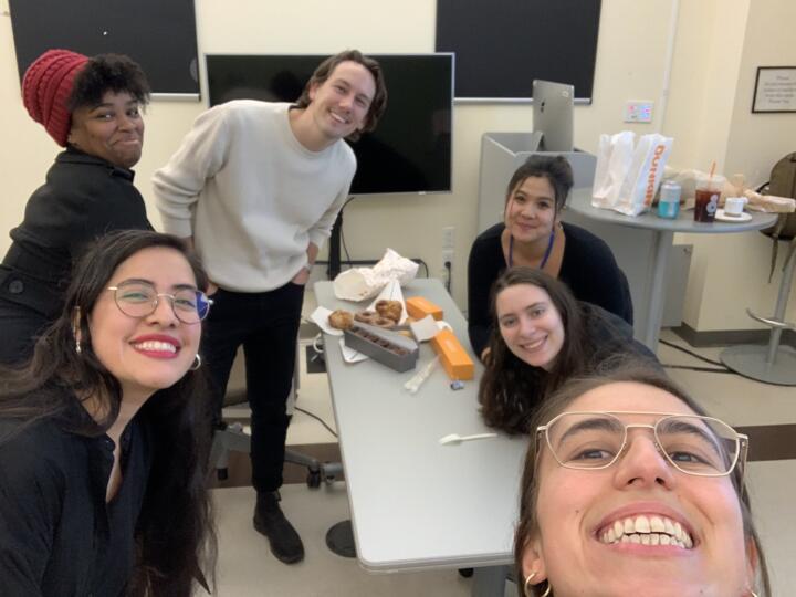 Selfie photograph taken by Ariana Perez-Castells showing her 4 other classmates and Lam in the classroom, smiling and looking at the camera