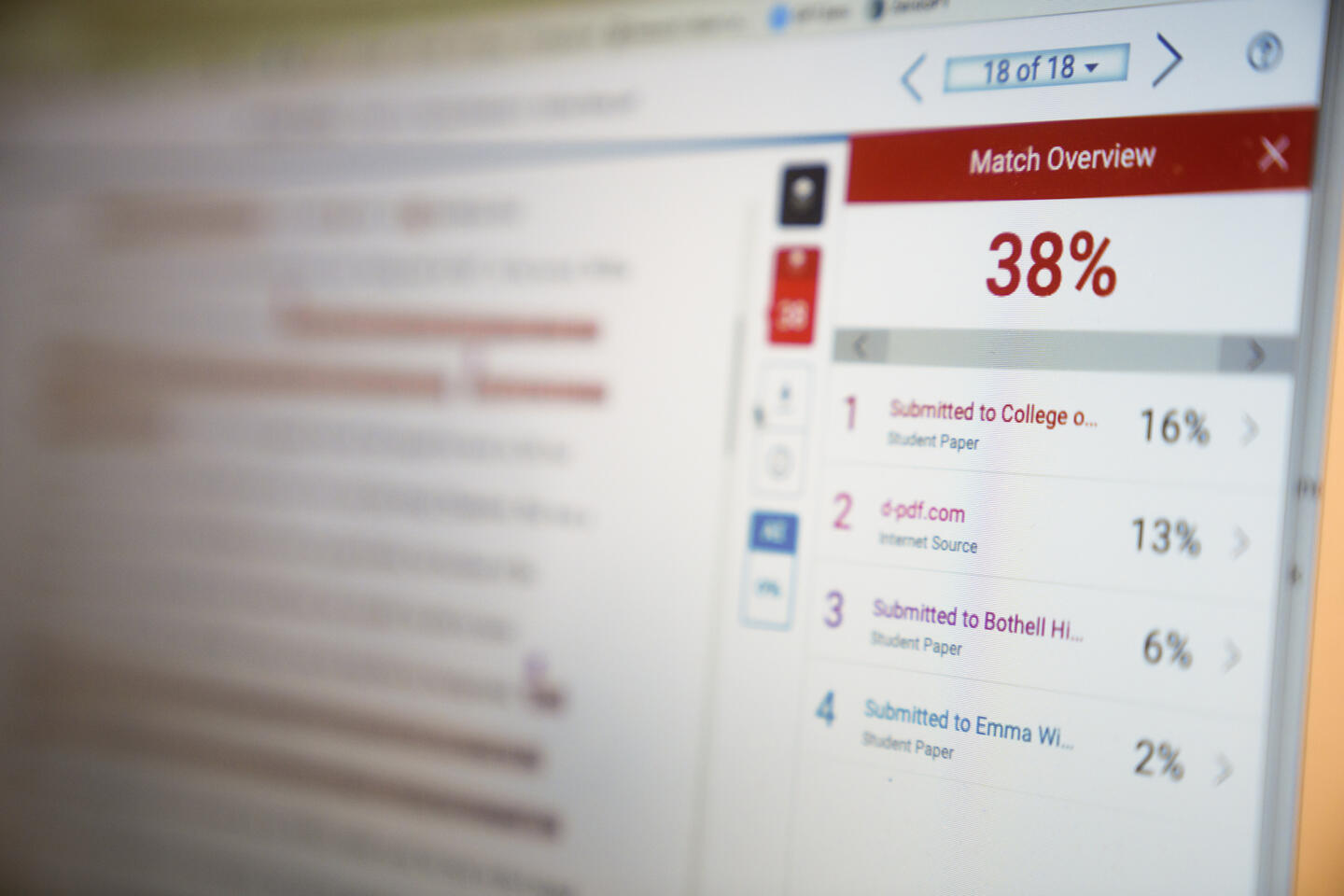 A computer screen shows a Turnitin similarity report with a 38% match score. The Match Overview panel on the right lists four top sources: student papers and one internet source, with the highest match at 16%. The blurred background reveals sections of a document highlighted in red to indicate matching text.